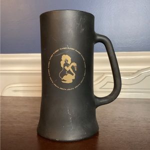 Vintage Playboy mug in fair used condition. Black/charcoal and gold.  6.25”.